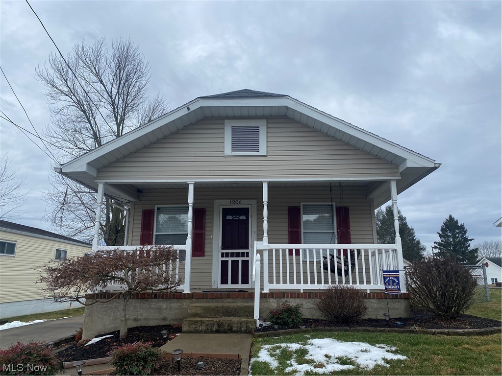Charming Bungalow on a Beautifully Landscaped Vienna Level Lot. Covered Front Porch invites you into the Open 25X12 Dining Room Living Room Combo. The Bungalow has the 1st bedroom on the front of the home & the 2nd on the back of the home w/ a nice sized Updated Bath. The Updated Galley Style Kitchen leads you into The Office Laundry Room Combo on the back of the Home which has an exterior door taking you out onto the New 21X15 Deck overlooking the Lovely Fenced Landscaped Backyard. Many Updates have been made which include a Newer Roof, HVAC, Hot Water Tank, Refrigerator, Microwave, Interior Painting, Insulating the Attic & so much more. This Home may be small but what it may lack in space its Cozy Comforts are Quite Alluring. You will want to call today for your Very Own Private Showing. :)