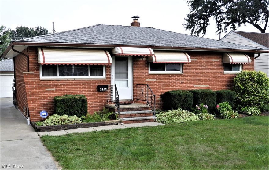 Three bedroom brick ranch * full finished basement has finished rec room, bonus room (previously used as BR4), walk-in closet, bathroom and laundry room * back yard is 100% fenced/gated * hardwood floors under carpet * 2 car garage * house has got great bones and some big ticket updates, but needs some cosmetics