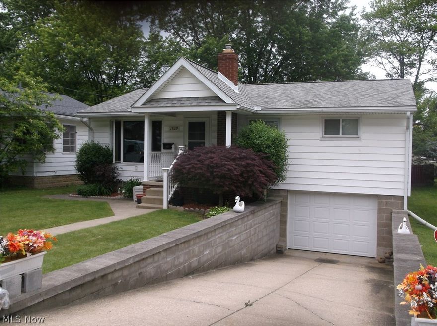 Adorable ranch with full walk-out basement to a fenced back yard.  The home features updated Kitchen, chair rail trim in dinette and hallway, Bath with newer window and tile flooring.  Other updates; Furnace, Central air, hot water tank and garage door in 2014.  New breaker box, storm door in lower level and fence in 2013.  Also glass block window in basement and garage.  The basement could be finished for added square footage.  Drain in drive way and sump pump control rain water.