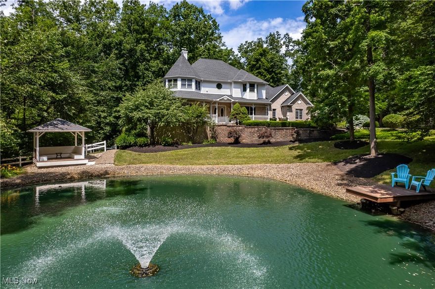 Welcome to this extraordinary gated estate nestled on 2.7 serene acres in Valley City. Boasting more than 4,200 square feet of living space across three finished levels, this 5 bedroom, 4 bathroom home offers the perfect balance of luxury, privacy, and functionality. Surrounded by lush woods and scenic views, the outdoor space is truly a retreat. Enjoy peaceful moments at the pondside gazebo, relax in the hot tub on the private patio, or gather around the outdoor fireplace and fire pit. A full wraparound porch, and expansive deck offers additional space to entertain or unwind. A heated 30x40 pole barn is insulated, has heat & water. Step inside to discover beautiful hardwood floors that flow seamlessly throughout the home, adding elegance to every room. At the front of the home, an office with rich wood trim and French doors creates the ideal work space. Just across the hall, the formal dining room is perfect for hosting gatherings and is centered around a charming fireplace. In 2016, the main level was remodeled to create an open concept layout, enhancing the flow between the kitchen & family room. The family room features a stunning stone fireplace and large windows that flood the space with natural light. The heart of the home is the kitchen with custom cabinetry, a stylish backsplash, stainless steel appliances, a center island with seating, and additional space for casual dining. Upstairs, the luxurious primary suite includes a spa-like bath with a fully tiled shower and dual vanities. Secondary bedrooms are generously sized & offer flexible living arrangements. A large laundry room completes this level. Downstairs, the fully finished walkout lower level features 2 additional bedrooms, full bathroom, full kitchen, theater room, rec area & safe room with storage. Secluded yet conveniently located, this one of a kind property blends estate style living with peaceful countryside charm. Don’t miss your chance to call this exceptional property home. Come see today!