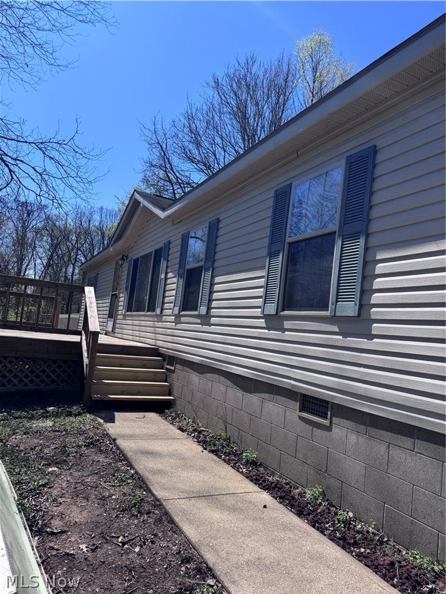 Great home with lots of privacy!  This home has 3 bedroom and 2 full bath.  Like new condition. Vaulted ceilings, Large kitchen that flows into the family room with fireplace.  Master bedroom with bath and 2 other bedrooms with Bath.  There is a big front porch as well as a back covered porch.  1 car detached garage and a storage building.  All this sits on 1.5 acre.  Call for your showing today.