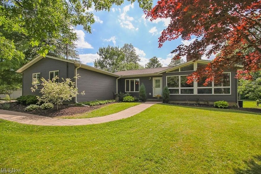 Mini Farm in Grafton Township! Spacious 4 Level Reverse Split on 22+ Acres in the Midview School District. Trails through 11 acres of woods with a creek! Beautifully updated exterior includes landscaping, new vinyl siding and roof 2020! New gutters and footer drains have been added by current owners. Interior features remodeled kitchen,with island, and granite in 2014, new dishwasher and microwave(2020). Vinyl flooring added in 2020 and baths remodeled in 2014. The living room features vaulted ceiling with floor to ceiling country views from the front windows and fireplace. The master bedroom features an updated ensuite with ceramic tile shower and granite countertops, and a 20x10 balcony for enjoying the pasture and wooded views. The walkout lower level with a full bath, family room, with fireplace, and large bedroom that could be used as an additional living suite! Ample basement with tons of storage and laundry area. New furnace in 2017 and Hot Water Tank in 2018. 60x36 Barn features 9 stalls, new roof in 2020, All new electric and new plumbing main line ran to the barn in 2015 with outlets for heated water buckets and water trough and hydrant(2020) Run-in shed added in 2020 features double sliding doors. Mud free system added to the paddock. Current owners have also installed electric fencing for the pasture. The barn is picture perfect, making it ideal for country wedding, or other photography. Ask about tax credit opportunities. 1 Year Home Warranty Included!