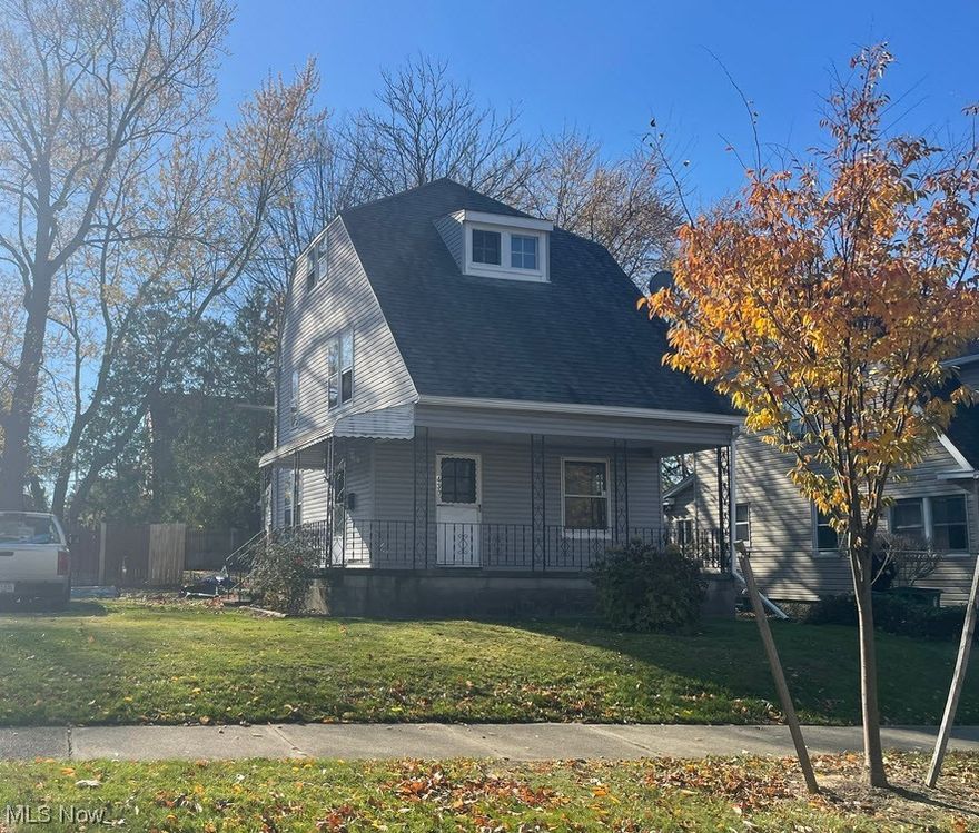 This property features a living room, dining room, kitchen, and half bath on the first floor. 3 bedrooms and a full bathroom are on the second floor, and a finished attic is on the third floor. A front porch and attached 1 car garage are also features of the home.