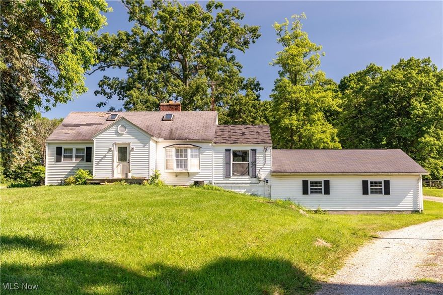 Welcome to this rare opportunity in Jackson Township – nearly 8 acres of beautifully flowing land with a large barn and endless possibilities. This property, long cherished as a horse property, is spread across two parcels: 5.15 acres with the home and barn, and 2.79 acres featuring an outdoor arena. Together, the parcels offer approximately 366 feet of road frontage, are zoned R-R, and present potential for a three-parcel split with zoning approval. Located in the desirable Jackson Local School District, the property is also conveniently accessible to the Akron/Canton area. Sewer availability is currently being confirmed, as it runs across the street, and mineral rights convey with the 5.15 -acre parcel. The barn and land are the true highlights here, offering a fantastic setup for equestrian use, hobby farming, or the creation of your dream estate. The home features has one portion updated (2009), updated electrical, and a well pump, hot water tank, and furnace all replaced within the last four years, but it is priced to reflect the need for significant updates and is being sold as is, with no repairs made by the seller. This property is available for cash or conventional loan buyers only – don’t miss the chance to transform it into something extraordinary!  Preapproved buyers only.  DO NOT DRIVE UP ON THE LAND, APPOINTMENTS ONLY.