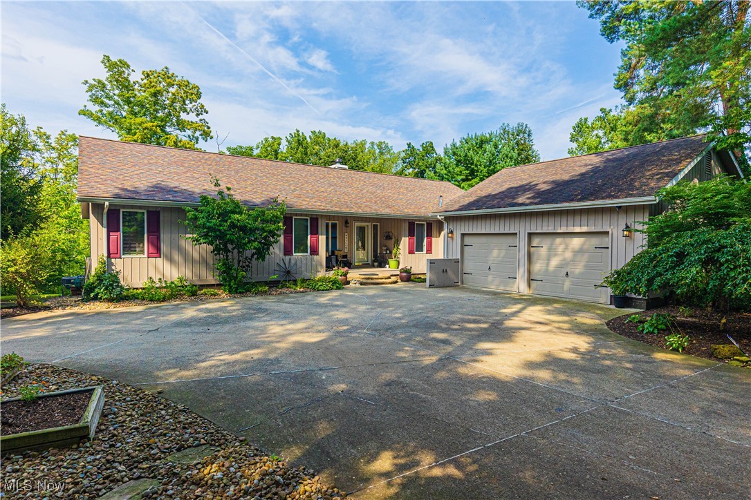 Incredible opportunity on this beautiful open-concept ranch with complete separate living quarters in the walkout lower level. Perfect for extended family (in-law or teen suite), entertaining, or out of town visitors. Main floor features kitchen with granite & all appliances, see-through fireplace between living and family rooms, owner's suite with recently renovated luxury bath & walk-in closet, 2 more bedrooms and updated full main bath. Also a main floor laundry room and a half bath convenient to garage entry. Enter the lower level via unique spiral staircase or standard steps assisted with handy chair stairlift. Lower level offers another spacious kitchen with granite & all appliances, living room, energy efficient wood burning stove (new in 2023), 2 add'l bedrooms, full bath renovated in 2024, wet bar/wine cellar, and separate 2nd laundry area. House exterior painted in 2023. Furnace and A/C replaced in 2025.
Back deck is full width of the house, overlooks the private wooded property, and includes a fabulous hot tub with direct access from the owner's suite. Add the extra deep garage, city water & sewers, and ideal location between Medina & Brunswick, and this one has it all!