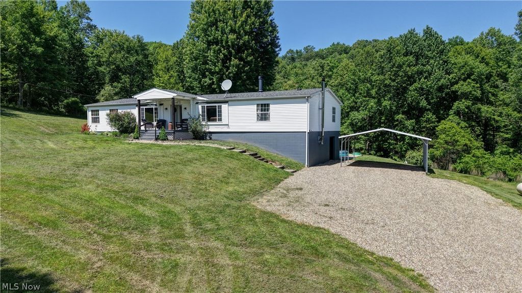Photo of 557 Beans Road SE, Sherrodsville, OH 44675 (MLS # 5223041)