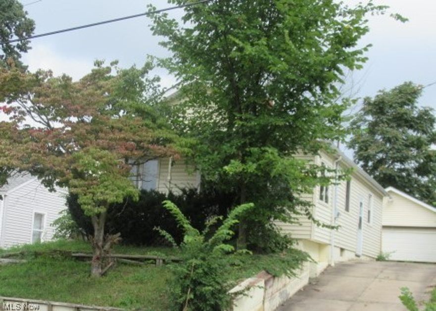 Ellet Area Ranch Home features Two Bedrooms on Main Floor back bedroom with Patio Door appears to have been used as an Office, Large Living Room, Nice size Kitchen with Dining Nook, Two Car Detached Garage, and Full Part Finished Basement adding additional living space with a Large Family Room, Half Bath, and Laundry Area. Additional Storage in Utility Area. This is a Great Investment or Handy Owner Occupant Opportunity, Priced accordingly. Location is minutes from Shopping, Convenience Marts, Gas, Several Fast Food Restaurants, and other Dining. Don't wait on this one, it will not last at this price in this market! Agents see Broker Remarks for placing your offers. This property is to be Sold AS-IS with all faults. Attachments are Required with all offers. Multiple Offers Received.