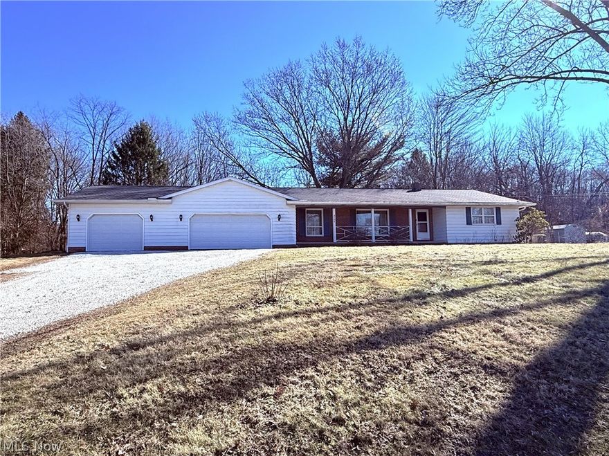 Tuslaw Local Schools Ranch nestled on 1.25 acres in a serene, country like setting. This well maintained ranch offers 3 bedrooms, 1 full bath, and a half bath. Hardwood floors grace multiple rooms and hallways, and the master suite features his and her closets for plenty of storage. The spacious living room is perfect for gatherings, and the first floor laundry adds convenience. The full basement includes a large workshop area ideal for projects or extra storage. Enjoy the large 3 car garage with water access, drain, electric, and abundant outlets, perfect for hobbyists or car enthusiasts. Updates include a high efficiency furnace, central air, Kohler generator, and water softener. Relax and take in the beautiful scenery surrounding the property. This home combines comfort, functionality, and country charm!