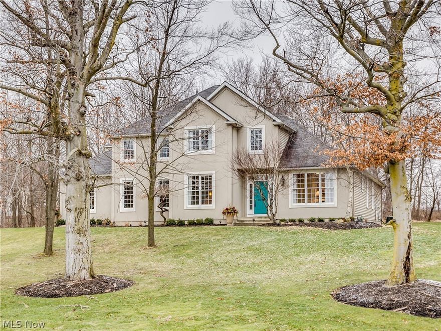 This beautiful custom 2-story is nestled on an unbelievable wooded 2.5 ACRE lot. The many recent updates make this the perfect move-in-ready home. The 2-story foyer offers large windows that illuminate the room with natural light and a stone gas fireplace.  The gourmet kitchen has an extra large island with seating, double ovens, trash compactor, wine racks, ample storage, a built-in breakfast nook and door that exit to the back deck. The first floor luxury master suite has everything you could ever want with a custom book shelf/ entertainment center, and En Suite master bath. No detail was overlooked in this master bathroom with a custom tiled walk in shower, freestanding claw foot bathtub, heated tile floors, his and hers walk in California closets, and a coffee station to enjoy your morning Cup-of-Joe without having to leave the bedroom. A large first floor laundry, elegant dining room, private office and half bath complete the first floor. 3 Bedrooms and two additional full baths l