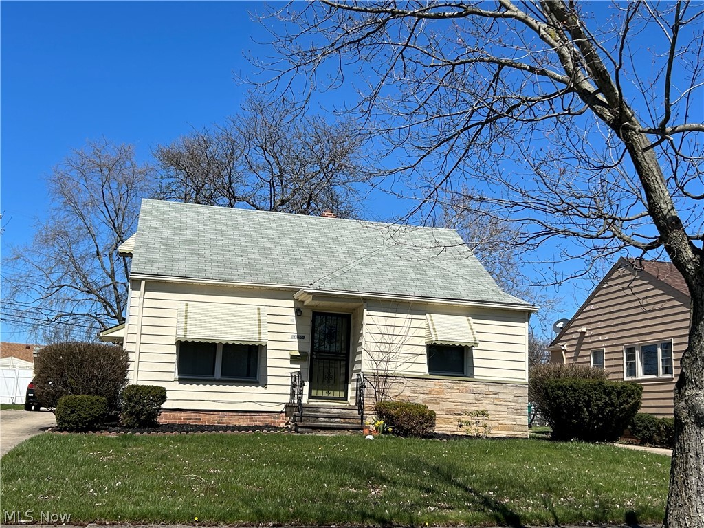 Well maintained bungalow with replacement windows, hardwood floors, replacement furnace & a/c, 2 car garage.