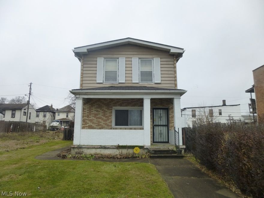 Solid brick home with detached 4 car garage off alley. Roof on home approximately 10-11 yrs old. Brand new steel roof on garage. Unfinished basement. 2 lots with this home. Side yard is fenced in for privacy. Cute little covered patio on back of home. TAXES ARE TO BE DETERMINED.