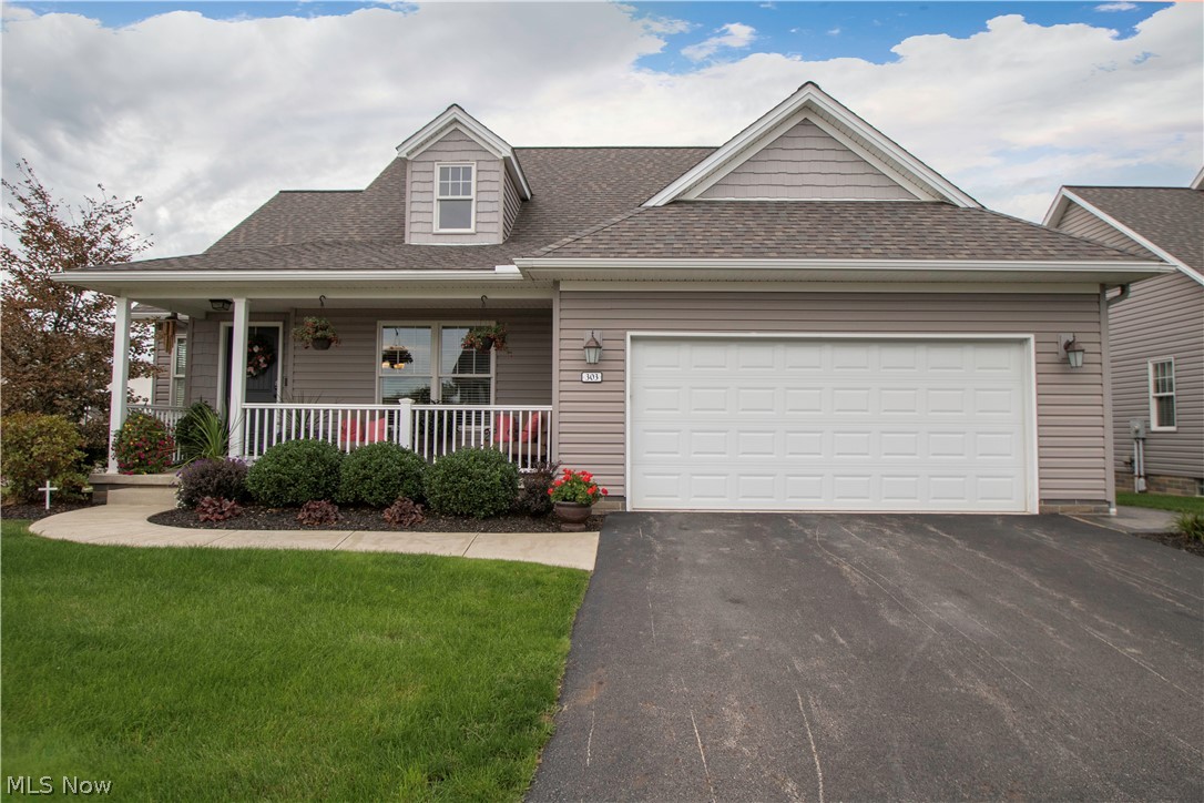 Are You Looking for the Perks of homeownership without the maintenance? If you're looking for a First Floor Master Bedroom, First Floor Laundry, LARGE Open Floor Plan for entertaining, Custom Landscaping and Hardscaping, and an attached 2-car garage THIS IS VILLA! This beautifully designed home is located in Old Saybrook, Columbiana. This particular villa was their "Show Unit" with features like high end mechanical systems (Tankless Hot Water Heater, Radiant Heated Floors in the Basement, High End Cabinets, Counters, lighting, and building materials. Kitchen counters have been recently replaced with custom granite countertops. Large Island in the kitchen, and all newer top of the line appliances. The owner added a man door to the side of the garage to allow access to the garage without opening the overhead door. Back porch has been custom done including a brand new cement patio and custom stairs that lead to the back of the property which overlooks a small retaining pond. Large M
