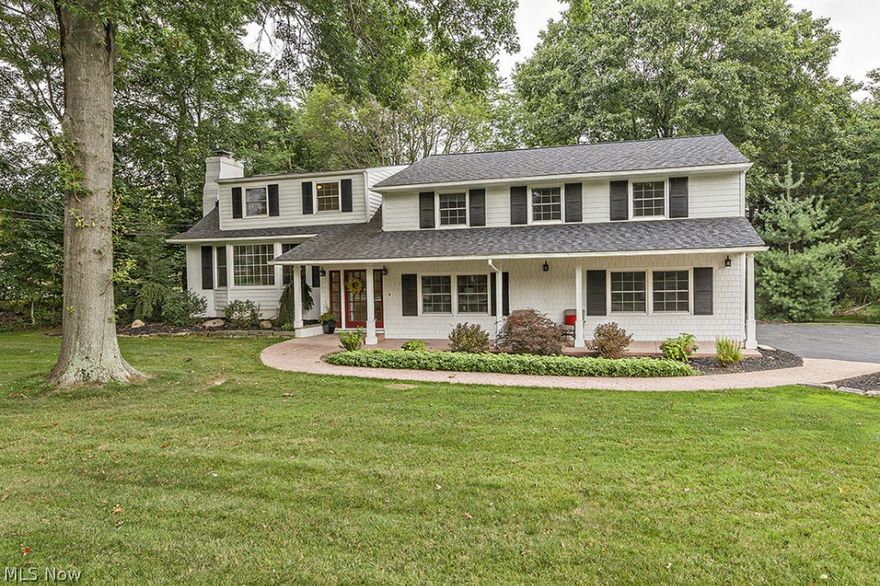 The best of both worlds! This exceptional split level home combines phenomenal space with first class detail. The first floor offers charm and sophistication with an open floor plan, gleaming hardwood floors, and upscale details. Enter to an inviting foyer and front dining room with a fireplace and oversized bay window. Through the front hall, you will find a state of the art kitchen boasting granite counters, tile backsplash, stainless appliances, breakfast bar with pendant lighting, skylights, generous eat in area, and doors to the tiered back deck.  Past the kitchen is the living room with fireplace, plenty of windows, and an attached sitting room. Walk down the stairs to the large family room with a third fireplace, vaulted ceilings, wall of windows, and access to the expansive back yard. The first floor also features a large mudroom, laundry room, front office, and full bathroom.  The master suite showcases a glamour bath with top of the line steam shower, Jacuzzi tub, his and her