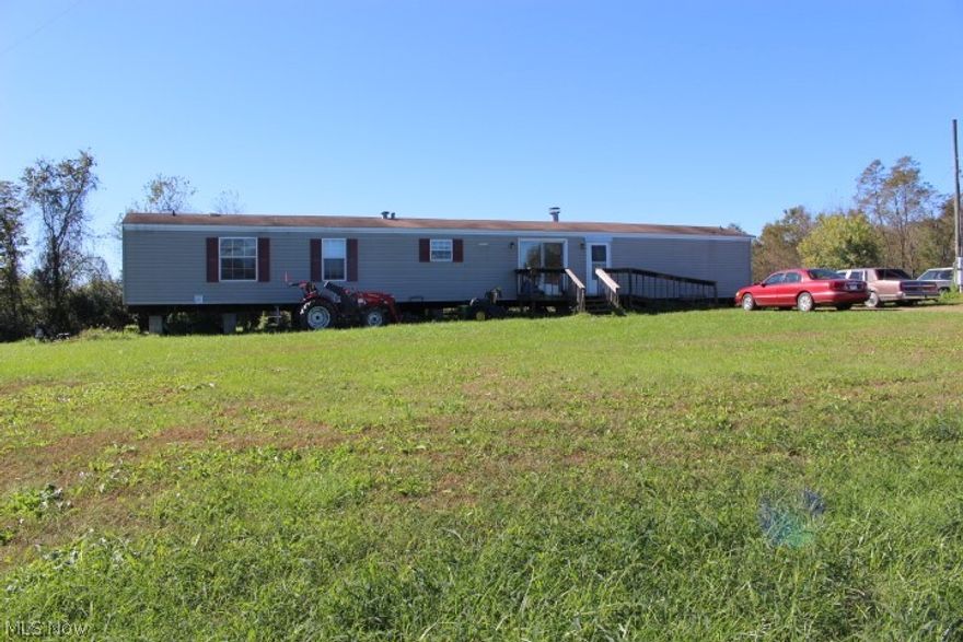 Great Land Located on Burnett Road.  There is a 2003 Clayton Blazer 16 x 76 that has not been converted to real estate.  The land would be perfect for horses, or a small gentleman's farm.  The Mineral rights go with the property.