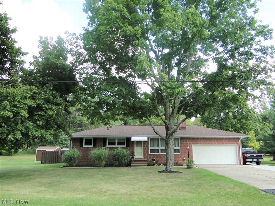 Jackson Township Ranch with almost an acre. Got your attention? Let's start with the Eat-in Kitchen: totally redone with Hickory cabinets, Granite Counters, new sink and deluxe faucet, sweet stainless appliances and grouted laminate flooring. Hardwood floors in Living room, bedrooms and hallway. Family room has a wood burner insert on the fireplace for the chilly days on the horizon. Extremely spacious & versatile Sun room that opens to the private backyard offering a hot tub. Lower level offers a full bathroom, laundry room and partially finished area. How about a location close enough to the Strip for retail and restaurants and ease to I 77? From Niche "Jackson Local School District is a top rated, public school district located in Massillon, OH. It has 5,977 students in grades K-12 with a student-teacher ratio of 23 to 1." And, no wallpaper!! Ready?