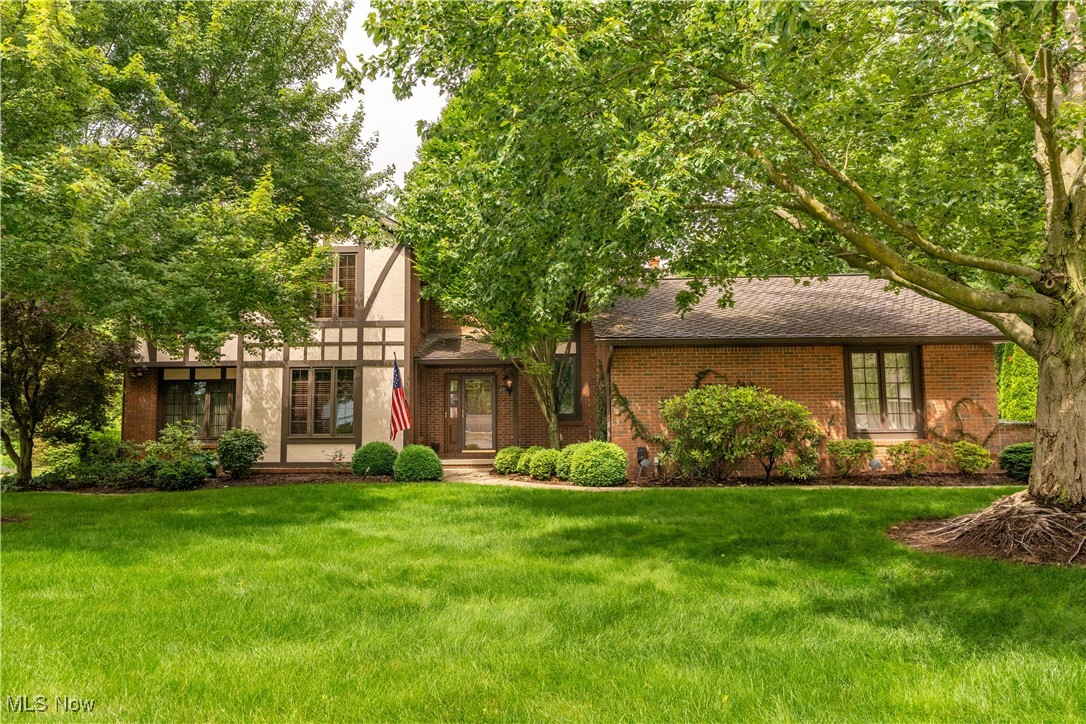Custom-built one-owner home with over 4,950 sq ft of finished living space on beautifully landscaped .55-acre lot in desirable North Canton Schools. The sellers had this home custom built, have lovingly cared for it, but are downsizing. This home boasts 4 generous bedrooms, and 3.5 baths. The brick and stucco exterior opens to a dramatic foyer w/soaring ceilings, private library, and 4-season sunroom with a wall of windows overlooking serene backyard w/multiple patios-ideal for entertaining or relaxing. The spacious kitchen was updated in 2010 with high-quality Mullet cabinetry, Corian countertops, and double ovens. Formal living/dining rooms offer great space for gatherings, while the family room features a cozy gas fireplace with a heatilator. A 21x12 craft room addition provides flexible use as hobby space or potential 5th bedroom. Upstairs, four generously sized bedrooms offer ample closet space. The primary suite includes a walk-in closet and with a steam shower. Second full bath and lots of storage completes the upper level. The finished lower level features large recreation room, office, workshop, and abundant storage, plus a Bilco door for backyard access. Other highlights include neutral decor throughout, meticulous maintenance, and a 3-car garage with an epoxy-style floor. Conveniently located near Washington Square and close to biking and walking trails - this home combines comfort, space, and quality craftsmanship.
