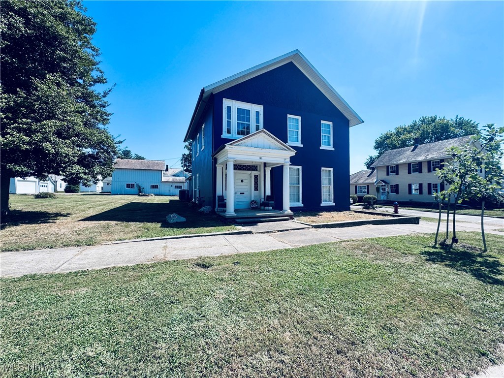 Welcome to this charming home located on a picturesque corner lot in the heart of McConnelsville. This well-maintained residence combines timeless character with modern updates, offering 3 bedrooms, 2 bathrooms, and spacious living areas filled with natural light. Fine hardwood floors and detailed trim work highlight the home’s historic beauty, while the updated kitchen and baths provide modern convenience. The main level includes an additional room that could serve as a first-floor bedroom if desired. Recent updates include a new roof in 2024 and a furnace/AC system installed in 2018. Outdoors, enjoy a generous yard and a two-car detached garage with loft space for storage, hobbies, or customization. With its inviting fireplace, large windows, and blend of old-world charm and contemporary comfort, this property is truly one of a kind.