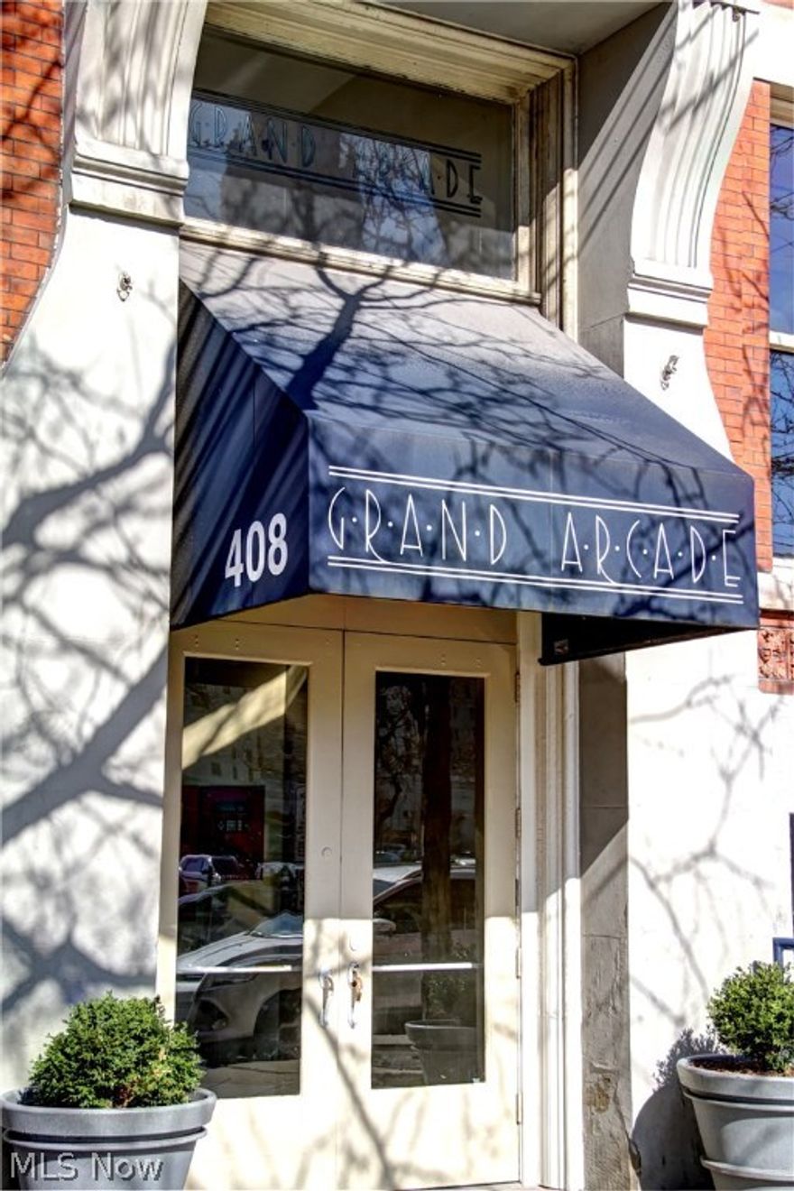 Welcome home to your stunning Downtown Cleveland loft. Perfectly located on the top floor of the historic Grand Arcade, centrally located in downtown’s most exciting neighborhood, the Warehouse District.  This unit not only offers ample space, lighting, and style, it also includes deeded roof rights allowing the option for rooftop living! As you enter you will quickly notice the stunning view of the beautiful Terminal Tower from the 10’ (newly replaced) windows, adorned with custom treatments with noise and light blocking shades. The renovated kitchen flows into the living space creating a large area for entertainment. The bedroom has room for a lot of storage, not only is there a large closet with custom shoe racks, but there is also a custom built armoire that will remain in the unit for extra storage. The current owners also built a front hall closet that houses a tankless water heater, coat racks, shoe storage, and a washer and dryer (that will stay in the unit). New ceiling with o