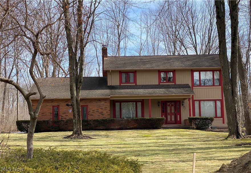 Police/Fire Dept. Serene,quiet Community surrounded by plenty of trees. This stunning, well kept Colonial Home features over an acre of well landscaped privacy lot. With 4 bedrooms and 2 1/2 bath begins with a walk in mudroom foyer with natural wood built in bench with storage, solid built in wood coat rack and closet for additional storage. Entrances from the large attached 2 car garage, side door., or the front entranceway. Bonus room off mudroom can be used as an additional pantry, storage room or update to a MAIN floor laundry. The Open concept design welcomes you to a large Kitchen with eat in area, kitchen Island, solid wood cabinetry, Imported tile flooring, and solid wood archways. The open concept kitchen invites you to a solid wood floor dining room for your family gatherings (NOTE: chandelier does NOT stay)and directs you into the  carpeted living room where you will find a gorgeous Raised Stone Hearth Fireplace with 2 solid wood trimmed Arched Radius windows with plenty of natural light for you to enjoy your wooded backyard view. The solid wood entranceway invites you to a carpeted stairway upstairs where you will find 4 carpeted and window treated bedrooms 3 of which have double door closets. The Master bedroom has a fully finished attached full bath with Imported tile floors and shower, and a large walk in closet. There is also a fully finished additional full bath upstairs with imported tile shower & flooring. The Full basement is 1/2 finished on one side for recreational purposes or as a quite serene office space. The uitility side of the basement has been well kept with new hot water tank, water softener system, utility tub, and plenty of storage space. Washer and dryer stay. There is also a wired Generac Generator installed. This well maintained and loved home is Move in Ready and awaits many more years of memories!!!!!