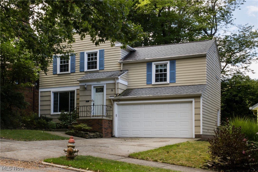 Welcome home to this classic colonial with a family room addition and a 2 car attached garage! Enter through the front foyer into your sunny living room with a large picture window and gleaming hardwood floors. The living room opens to the formal dining room and the updated and fully applianced kitchen. Towards the back of the home is a spacious family room that leads out to the beautiful patio and back yard! A convenient half bath finishes off the first floor. Upstairs are very nicely sized bedrooms with great closet space and a full bath. Fresh paint throughout. 2 car attached garage! This home has so much to offer and is move in ready! Dont miss it! Call your favorite Realtor today!