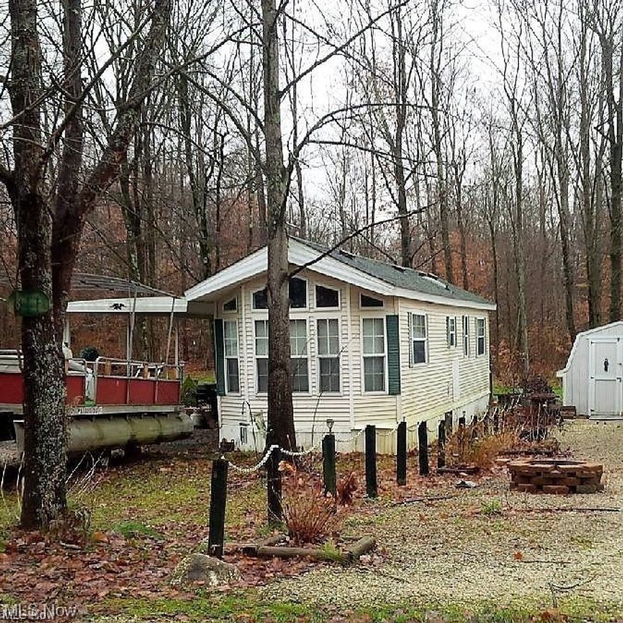 2001 Chariot park model manufactured and 2 LOTS  in Lake Village Campground. This "membership only" campground has secured entry with year-round access. Monthly scheduled activities that include; bus trips, bands, pot luck meals, bingo, and holiday-specific such as hayrides and Breakfast with Santa. Enjoy your own campfires and marshmallow roasts in your private backyard. Pets allowed as well as friends and family too. This one bdrm unit has an eat-in kitchen with plenty of window light with a roofed patio and a storage shed too. Vacant "in demand" sewer lot right next door is included; giving you two sewer lots; for your own use or extra guests. Winter water system in place for year around use in MFH. Call for your private tour soon this won't last long. LOTS ARE 33' X 117' EACH