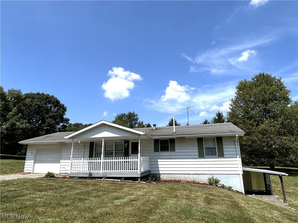 Your perfect slice of country comfort! This charming ranch sits on a full acre, offering true single-level living-even the garage is on the main floor. Enjoy a bright, spacious living room, eat-in kitchen, and the convenience of main-level laundry. Downstairs, the finished rec room is ready for game nights or movie marathons. Start your mornings or wind down your evenings in the comfortable, enclosed back porch, the perfect spot for morning coffee or wine with a view. Plus, there's a detached 1 car garage and a lean-to big enough for a camper-plenty of space for toys, tools, and adventures. Homes like this don't last-schedule your tour today!