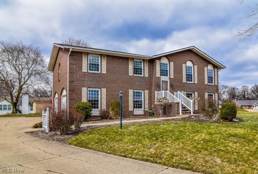 Completely remodeled 3 bedroom, 2.5 bath home with updates galore! Better than new with beautiful laminate flooring and fresh paint! Open living room, dining room and kitchen provides the perfect entertaining space. Prepare your favorite dishes in your dream kitchen! Beautiful cabinetry with soft close drawers, granite countertops, all new stainless steel appliances, ceramic tile backsplash and an integrated sink. Gorgeous chandelier in the dining room with sliding doors to the 19x16 back deck. Down the hall, the master suite offers 2 closets and a beautiful private, full bath with tile flooring, double sinks and granite countertops. The main full bath has also been remodeled with granite countertops, new lighting and cabinetry. Spacious family room on the lower level features a gorgeous gas fireplace. There's a lovely office with tile flooring, built-in oak bookshelves and an updated half bath. Enjoy relaxing in the heated sun room with a brand new roof, wood plank ceiling and tile fl