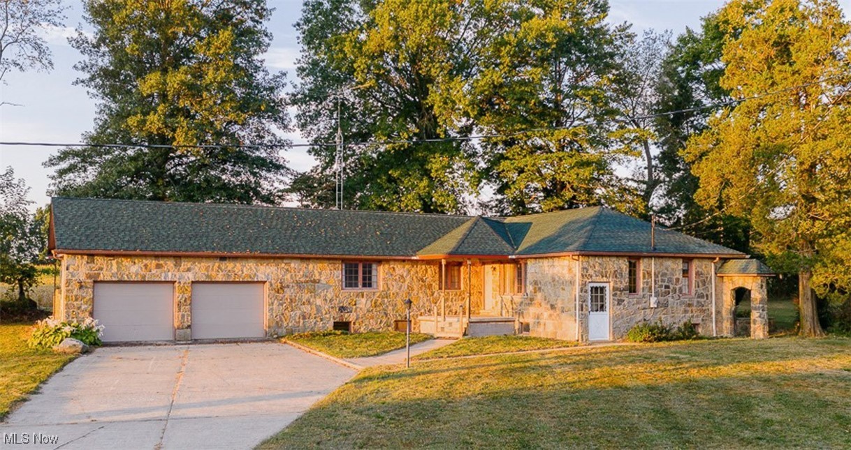 Anstine Vogley Orchard Farm, Rustic Sandstone Ranch Home, 24' x 72' Shop/Multipurpose Building, 50' x 72' Steel Trussed Outbuilding, Situated On 6.38 Acres W/ Country Setting. ABSOLUTE AUCTION, all sells to the highest bidder on location. Live Auction with Online Bidding Available. ONLINE BIDDING BEGINS WEDNESDAY, OCTOBER 8, 2025, at 12:00 PM, and AUCTION LIVE ON-SITE BIDDING WILL BEGIN FRIDAY, OCTOBER 10, 2025, at 12:00 PM. This property offers a country setting with a rustic sandstone ranch home with 1,917 sq. ft. An open concept design shares the oak kitchen w/ appliances, dining room w/ built-in corner curio cabinets and family room with built-in glass door wall cabinet. Large rustic living room w/ stone wood burning fireplace and door to outside. Main bedroom w/ double closets and zoned heat, two other bedrooms w/ closets and a full bath w/ updated walk-in shower & built-in linen closet. Full basement with Burnham Series 3-boiler zoned hot water heat, Rheem 40-gallon hot water tank, 200-amp. electric breakers, water well w/ softener, septic system and built in Vacuflo Vacuum System, plus walkout. Also, several other rooms, including rough in bathroom, laundry room w/ hook ups. Attached two-car garage w/ access to the basement, electric & access to the ceiling rafters. Outside consists of a 24' x 72' shop/multipurpose building featuring an open insulated room w/ wood burner, and beautiful rustic wood, wood beamed ceiling with fans, attached 3-bay garage w/ man door, 200-amp. electric breakers w/ refrigeration condenser for attached large walk-in cooler, large rear open room w/ double bay door, plus man door with a water hydrant w/ sink, attic access to upper large storage area and access to the walk-in cooler and concrete floors throughout. Situated on 6.38 Acres, lays mostly flat w/ tillable land currently planted in corn w/ lease from farmer tenant.Taxes are $1,234.72 per half year. Property open for inspection on Thursday, October 9th from 10:00 am-2:00 pm.