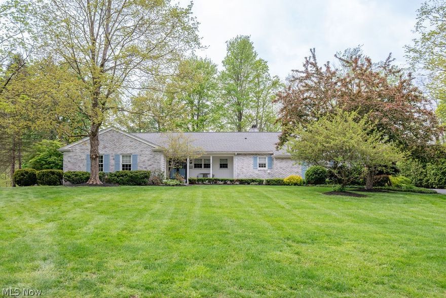 This exceptional large ranch home (3,200+ sq ft) features open concept living spaces on a quiet street just a short walk from downtown Chagrin Falls! Completely remodeled in 2018 with continuous upgrades since, the home sits on 0.47 acres of professionally landscaped, park-like grounds with a custom brick patio.The chef’s kitchen is equipped with top-of-the-line Thermador appliances, a wine and beverage cooler, and an oversized island. Four spacious bedrooms and 4 (2/2) bathrooms provide ample room for family and guests. The over-sized den features a wood burning fireplace and walkout slider. The fully finished lower level offers a game room, flex room and egress window. The finished garage includes workshop cabinetry and a Nature Stone floor. No need to worry about power outages as this home is equipped with a whole house 22KW Generac generator. The home also boasts a new roof, gutters, HVAC, electric… new everything! A truly one-of-a-kind home, not to be missed.