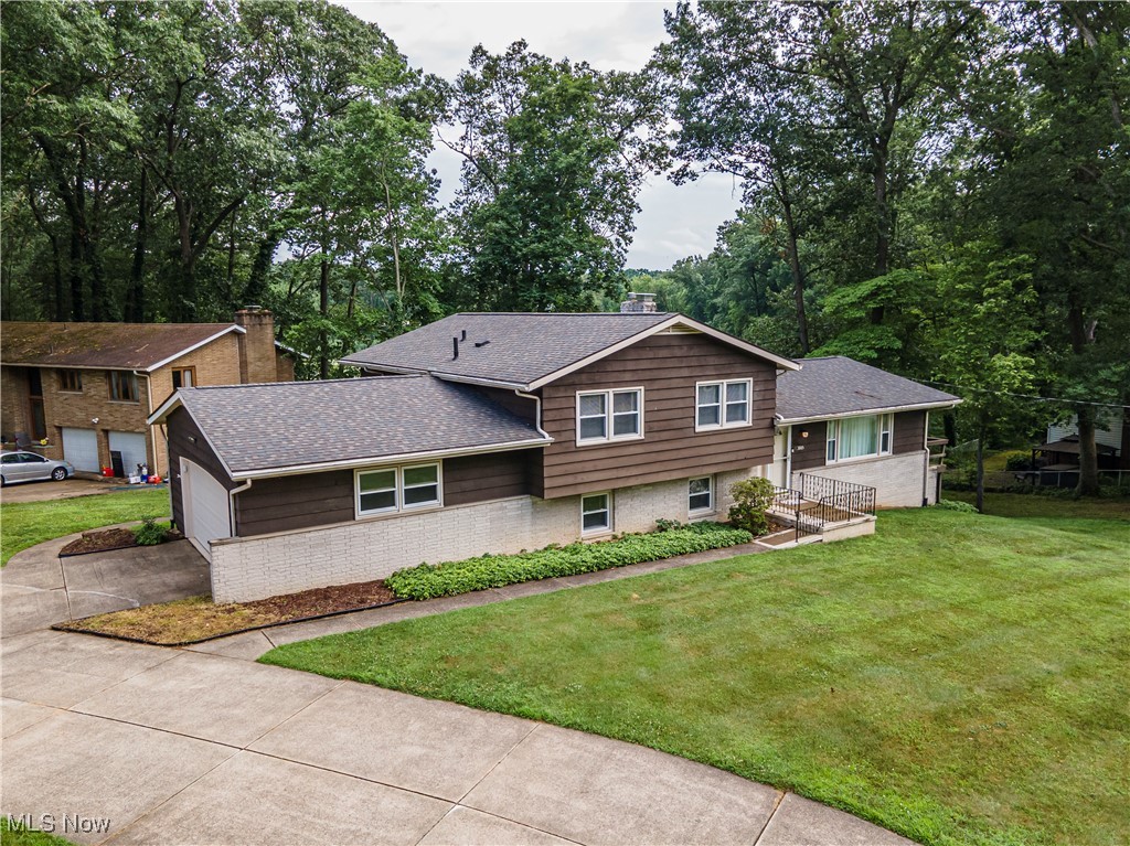 This spacious 5-Bedroom 3-Bathroom Home on a Corner Lot in Green... say no more!! This charming 4-level split offers a spacious and functional layout, perfect for families or those who enjoy entertaining. This home has stayed in the same family with only 2 owners. The main floor has an open concept feel with a more formal Living Area, Dining Room, Kitchen and Balcony Deck overlooking the backyard and neighborhood pond. The upper level has 2 full Bathrooms, 4 spacious Bedrooms with great closet space, including a Master suite with an en-suite bathroom. The 3rd level offers a cozy Family Room with Fireplace ideal for relaxing and entertaining, a 5th Bedroom with attached full Bathroom, screened in porch area with access to the back yard area. On this level you can also gain access to the large 2 car garage that opens to the side of the house. As you make your way to the Basement level you will find a versatile finished Bonus Space to use as an office or game room. On the other side of this space, you will find the laundry area. Home was updated with neutral tones featuring modern fixtures and finishes 4 yrs ago. Fresh paint, flooring, lighting, bathrooms, kitchen, appliances (2021), HWT (2025), well (2015), leach beds (2011). Washer and Dryer stay. Situated in a peaceful neighborhood, on almost an acre corner lot in Green LSD. Close to Restaurants, Shopping, Portage Lakes, State Park, Wineries, Golfing, Spas, with easy access to Highways. Auditor indicates 3 bed 1 full bath, but Seller states 5 bed 3 full baths. Come see why this home should be yours today!!