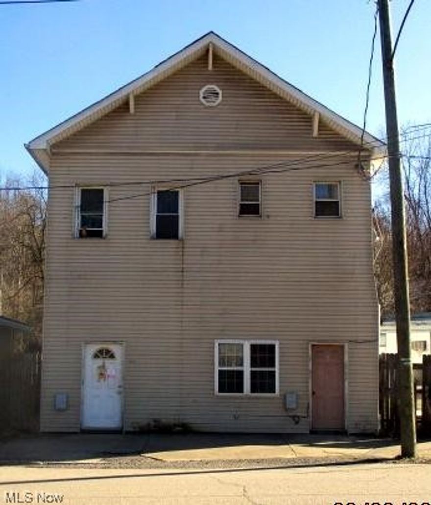 Priced to sell!  This two story triplex has a first floor 2 bedroom unit.  The second floor has two one bedroom units.  Lots of potential ... rent all or live in one and rent the others.  One of units upstairs is ready to be renovated. Currently two units are rented on a month to month basis.  Both tenants are long term renters.  Come take a look!