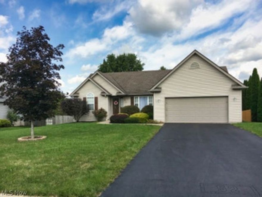 Amazing ranch home in one of Columbiana's most desirable neighborhoods. Beautiful freshly painted 1,800+ square ft. (including 350 finished in basement) with 3 bedrooms and 2 full updated baths. Updated laminate floors in eat-in kitchen connect to the vaulted ceiling living room in an open plan arrangement. Two large walk-in closets in the master BR. Basement has a large finished rec room perfect for movie night or playroom and a massive separate area perfect for storage and future expansion. Over-sized insulated/drywall 2 car garage and outdoor storage building are great for the handyman while the large rear deck is perfect for outdoor grilling and get togethers. This beautiful well-built and well maintained home won't last long!