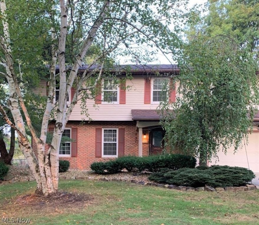 Welcome to 1084 Lawndale Drive, a 4-bedroom, 2.5 bathroom Colonial home in Tallmadge! This home has a gorgeous updated eat-in kitchen with beautiful wood cabinets, stainless steel appliances, recessed lighting, and a breakfast bar. Off the kitchen, there is a dining room, living room, and den. The den has a brick fireplace and sliding glass doors that lead to a patio in the backyard. Half bathroom located on first floor. The finished basement offers a ton of extra living space. This home comes with a camera system that works with WIFI and Apple phones. Updates to the home include: new windows, roof, and siding (2013).  Remodeled kitchen. New LVT flooring in living, dining, and family rooms. New carpet in bedrooms and staircase. Newer AC/Furnace and hot water tank. Don’t let this home get away! Schedule your private showing today!!