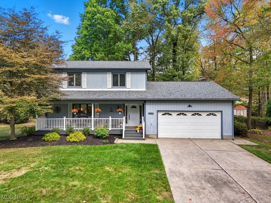 Welcome home to this beautifully updated Colonial located within the Copley-Fairlawn School District! A charming covered front porch with new Trex decking (2024) welcomes you inside to a bright, open-concept floor plan. The heart of the home is the stunning eat-in kitchen (2023) featuring quartz countertops, beautiful cabinetry, a built-in buffet, breakfast bar, and stainless steel KitchenAid appliances. Sliding doors lead to a spacious back deck overlooking an expansive yard—perfect for outdoor entertainment and relaxation. The cozy family room, featuring a gas fireplace, offers warmth and comfort, while the flexible main level also includes a living room and a newly renovated half bath (2023). Upstairs, the primary suite boasts a spacious closet and a remodeled full bath (2025). Two additional bedrooms and another updated full bath (2025) complete the second level. Recent improvements include: roof (2021), Trex decking on both front and back (2024), reverse osmosis system (2023), new flooring in kitchen, dining, living, and upstairs baths (2025), Samsung range, KitchenAid refrigerator(2023), dishwasher and microwave (2023), septic system (2014), and radon mitigation system (2024). This home has been meticulously maintained and cared for and you will see that all that’s left to do is move in and enjoy. New owners will have the option to join member-only Lake Bluebird; they will need to contact them for details to join.