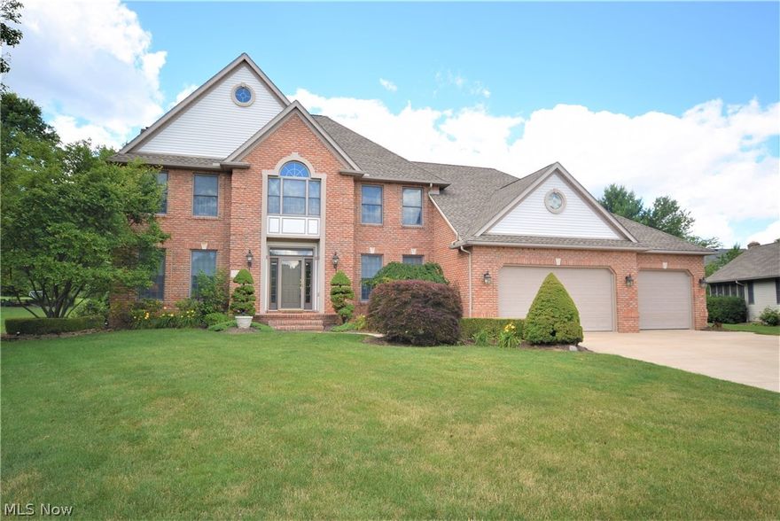 Stunning 5 bedroom, 3 bath custom built home with a 4 car garage in Tallmadge! Beautiful sun-room with a cathedral ceiling off the large, open kitchen! Kitchen features island, attractive hickory cabinets with granite counter tops, stone tile backsplash and built in desk. The Butler's pantry has cabinets and a sink and has a door to access the rear yard for entertaining! Formal dining room and living room, first floor bedroom or office, and a sunken family room with a fireplace that looks out to a beautiful yard and deck. Master bedroom has two walk-in closets and giant bathroom with dual sinks, makeup desk, corner tub and private commode/shower room. Laundry room is on second floor for convenience. 3 additional bedrooms and spacious bonus room complete the second floor. Freshly painted and cosmetic updates completed, this is move in ready! Enormous 14 course basement with wet bar, pool table, darts, sitting area and workshop. Basement workshop area also has a convenient staircase up t