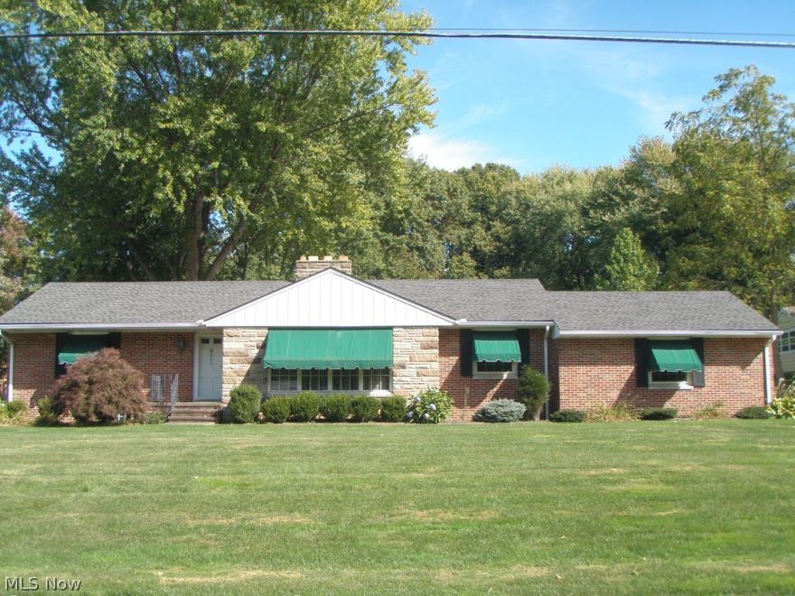 All brick and stone Ranch home. Stunning inside and out.  Features lots of quality workmanship with crown molding, wood beamed ceilings, built in cabinets. Fabulous Great Room addition with gas fireplace and half bath or could make fantastic 3rd bedroom (master) with bath. French doors between Great Room and Den. Spacious formal living room w/second wood burning fireplace. Formal Dining Room. Beautiful kitchen with separate eating area, Corian sink, built in hutch, chair railing, wainscoting and large pantry. HW Flrs under carpeting on 1st and 2nd level except GR. Inviting lower level Rec/Family Room w/third sandstone fireplace, new carpet and wine room with bar. Many updates include newer windows, roof 10-12 yrs.  Waterproofed basement w/sump pump, glass block windows. Irrigation system front and side of home. Appliances 4yrs old. Newer H2O tank. 2 car attached garage. Updated electric. Large deck and 14x12 ft storage barn shed. A must see! Move in condition.