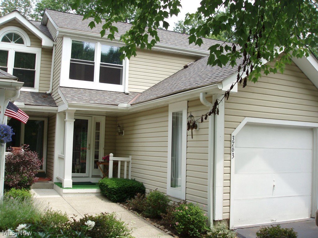 Exceptionally nice townhouse/condo with a walkout lower level. Nicely decorated throughout. Remodeled Kitchen. Foyer entry with Tile floors. Living room with sliders to deck porch overlooks semi private backyard. Nice sized bedrooms with vaulted ceilings. Lower level walk out family room with newer carpet and woodburning fireplace. Attached garage. New Windows and Sliders. Convenient to shopping.