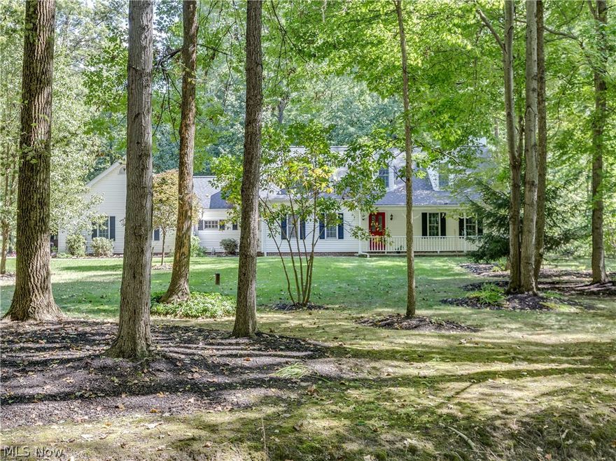 Spacious 3 bedroom, 3 bath Cape Cod nestled on 5 acre wooded lot with stocked pond, pole barn, shed and lean-to. Home has a 2 car attached garage and also (3 car gar) pole barn with wood-burning stove, 100 amp electric and water, air compressor, exhaust and work benches.  Home was built in 1991 and comes with a one year home warranty.  1st floor master suite with private bath and walk-in closet. Family room features wood burning stove and french doors to rear side walk. Inviting front porch with swing for your enjoyment. Recent improvements include roof 2012.