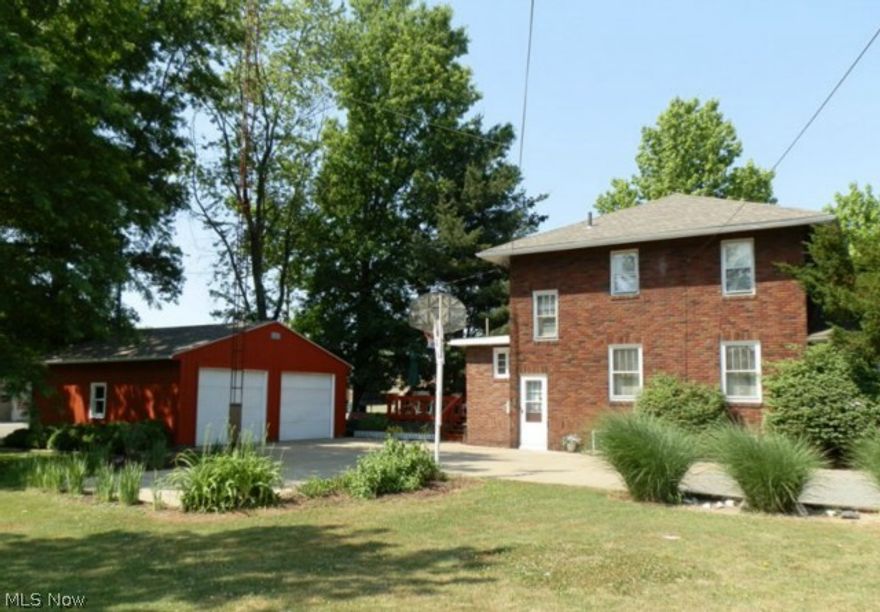 Beautiful brick 2 story home in North Dover. Close to I-77 interchange. Very well cared for home. Updates are furnace & AC (2003), house roof (2011), garage & barn roof (2012), well pump (2012), flooring new in past 5 years. Lots of character in kitchen with original cabinetry with oak stained & glass knobs. Walk in pantry and half bath. Family room /den has 1 wall of built in book shelves. Tiered deck off of eat-in kitchen. Lots of perennials & shade trees on lot. Sellers offering 1 year Home Warranty. Utilities averages are gas $80, electric $118, hot water heater rental $18.