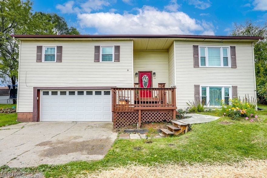 Welcome Home! This beautiful bi-level home situated in the heart of Lakemore just minutes from Springfield Lake is awaiting its new owner! Situated on one of the larger lots (3 parcels), and with plenty of updates both inside and out, you'll surely love this home. Upstairs holds 2 spacious bedrooms along with a master bedroom (with en-suite). The master bathroom has been renovated with new flooring/paint/trim/vanity/etc. Just down the hall is the living room with plenty of natural light from the brand new windows! LVP flooring throughout the first floor! The kitchen has plenty of cabinet space along with a dining area as well. Enjoy your morning coffee on the side deck as well! As you head downstairs to the lower level, you'll see an additional rec room, extra bedroom/office area, large storage closet, and newly renovated half bathroom! This home has too many updates to list! Make this house your home before its too late!