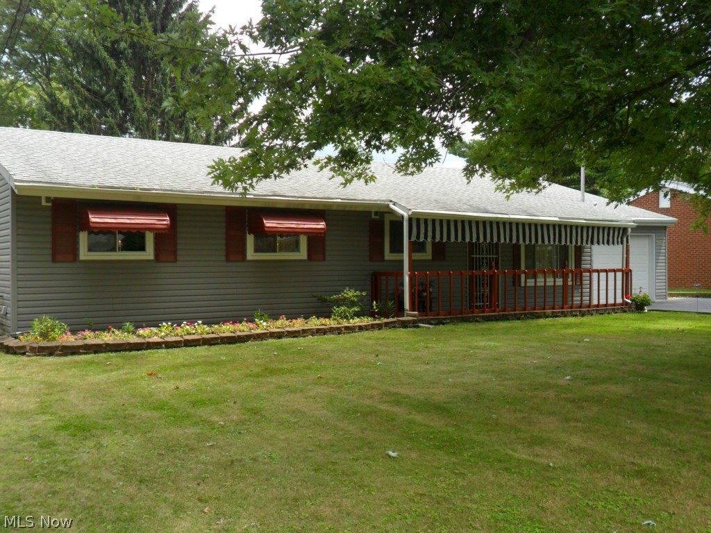 This "must-see" well-maintained ranch home has been enhanced with many recent improvements. New roof (2006); new carpet & flooring (2009); new furnace & AC with transferable lifetime warranty (2011); bathrooms remodeled (2011); main living spaces painted (2008); new shed roof (2013); new pull-down garage dormer storage ladder (2013); new outdoor carpet on front porch (2012); new refrigerator w/pull-out drawer freezer (2013). Enlarged master bedroom with plentiful storage space (2 large master bedroom closets). Newer windows and siding, 8'x 20' workshop and 5' x 9' storage room in garage. This home has a lovely exterior with an inviting front porch and spacious front and back yard space (back yard enclosed with chain link fence). Extra shed provides additional storage space perfect for mowing/landscaping/gardening equipment. This home is priced to sell. A short commute to KSU campus.