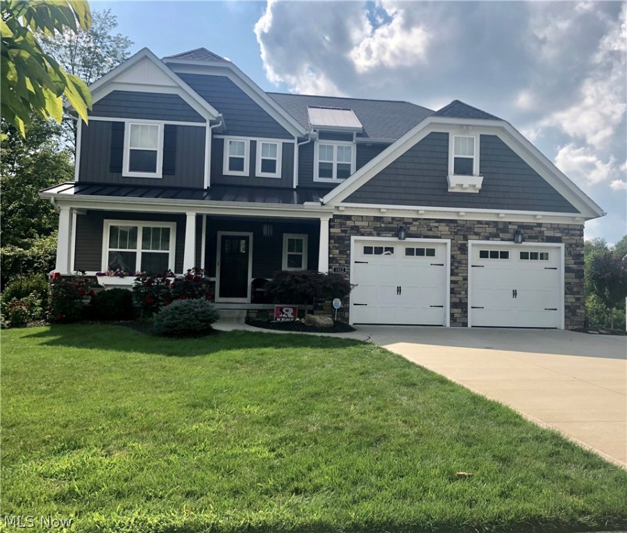 Absolutely stunning home with all of the extras and upgrades! Open concept from 2-story great room with entire wall of windows looking into nature, fireplace, and awesome ceiling fan to the highly appointed kitchen with stainless steel appliances and HUGE island w/plenty of seating, granite counter tops, walk-in-pantry and dining room w/wall of windows. Laundry room is huge with plenty of storage area and laundry chute from the 2nd floor. As you walk in the woodcraft front door into the hand scraped wide planked hardwood foyer, it is flanked by a home office/study/library that is accented with 6' wainscoting and 9' ceilings. The mud room is right across the hallway with built-ins that leads from the garage. The kitchen has all of the bells and whistles with many upgrades consisting of great lighting, granite counter tops, plenty of storage, easy to close cabinetry tot he large open dining area with a wall of windows and a door to the exterior deck. The second floor has three larg