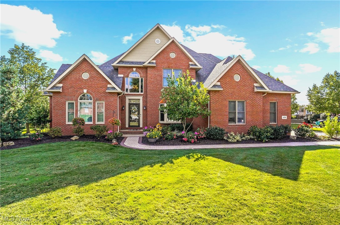 Now is your chance to join the prestigious Fox Meadow golf course community! This custom 4-bedroom, 5-bath, brick Colonial offers total first-floor living with uncompromising quality throughout. Refinished hardwood floors, soaring ceilings, and natural light flood the two-story entry. To the right is a spacious Dining Room, and to the left is a private Office or Den. As you enter the great room, featuring floor-to-ceiling windows and a gorgeous stone fireplace, you can't help but stop and imagine your life here. The updated kitchen will spark your inner home chef with a large quartz island, stainless steel appliances, and quality cabinetry. The charming Sun Room opens to the composite deck and paver patio, overlooking the private wooded lot. A newly remodeled mud room and first-floor laundry are conveniently located by the 3-car side entry garage. Retreat to the first-floor master suite with a renovated bathroom and walk-in closet, or to the home's second level, with 3 more bedrooms, a jack-and-jill bathroom, and a large 4th bedroom - ideal for guests! There's even more space in the finished lower level, which features an office, a second family room with a rustic stone fireplace, a rec room, a large kitchenette, and a half bath. The basement also includes a workshop and a staircase out to the garage. Many upgrades, including newer first-floor windows, a newer roof, furnace, appliances, paint, carpeting, window coverings, whole-house water filtration, new landscaping, and so much more! PLUS, an exclusive yet optional resident-only access to the Fox Meadow Country Club with 18 holes of golf, a pool, and a private clubhouse! Life in this coveted community has never been so sweet or affordable. Make your move today!