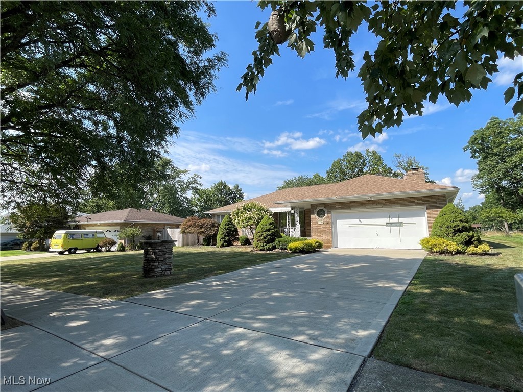 Fantastic BRICK RANCH Style Home features large rooms including***A 4 Season Room that overlooks a beautiful lake right behind the home***convenient Kitchen with all appliances***3 Great Size Bedrooms***full length Recreation Room with bar***Laundry on 1st and lower levels with washers and dryers***Home features entry through the SUN room a wheel chair ramp to the rear deck*** There is so much room available in the basement you could fit an entire house***The roof on this home was replaced within the last couple years and has many premium features completed by the owners***A retractable awning covers the rear deck when desired and a deck high grill with stay with the home. This is a must see!!!