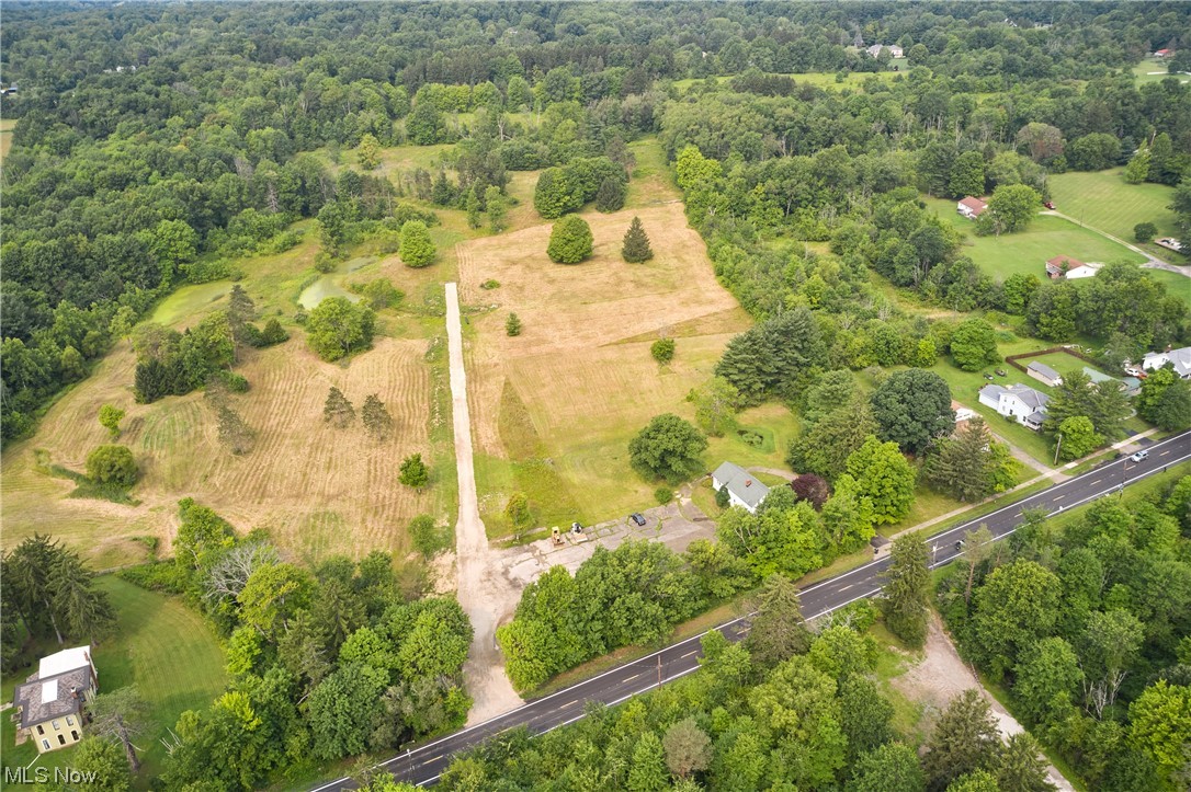 Drive down a private shared drive to a gorgeous slightly sloped 5 acre piece of land in the heart of Richfield. Set almost 500' back from the street, this private lot is the site of your future home. Privacy gained from being heavily wooded with evergreens at the northern border. The land rises gently to the NW corner of the lot, punctuated by 2 gorgeous mature maple trees. With Eastwood Preserve to the west and shopping & dining conveniently located nearby, you'd never know that you're located just minutes from I-77, 271 & 76. Village easement will provide direct access to Eastwood Preserve. This dream location is in the award-winning Revere school district.