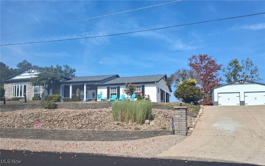 Amazing panoramic lake views from front and back of home. This home is one of only a handful of homes with a double view. Situated on 2 lots, this home also has an extra garage as well as ample flat parking for multiple vehicles.. Completely updated on the outside, roof (2020), siding, fascia, soffits and gutters (2022). Additional garage (2022) and new grinder pump (2023).  Multiple outdoor entertaining areas in the front and back of home. Attached garage is finished with heat and new lighting (2023). As you step inside, you are met with light, airy rooms including a 10-foot ceiling in the living room. Extensive updates inside the home including new Pella windows (2020), kitchen cabinets, granite countertops, flooring, paint (2020), new central air and water tank (2020), new High-efficiency furnace (2025). Perfect for entertaining with its large open concept living room area and attached 4 season room overlooking the lake. 14 x 14 all weather pergola with heaters, fan and clear drop curtains over looking the lake. Lake Mohawk is a 500-acre private lake with unlimited horsepower, 3 beaches, tennis, pickleball courts, 9-hole golf course as well as many clubs to join.  Truly a paradise!  Immaculate move-in condition!