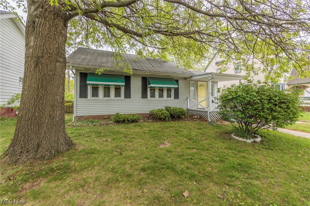 This lovely, Bungalow home includes a welcoming large covered front porch, sweet awnings and a cheery front door. Heavy wood molding and neutral colors run throughout. The kitchen has white cabinetry, a ceiling fan and a double stainless steel sink. Additional storage can be found in the full basement with a workshop area and large utility sink. Fully fenced back yard with a rear entrance. The detached one car garage in the backyard is convenient for maintaining the yard. Schedule your private showing today before it's gone!
