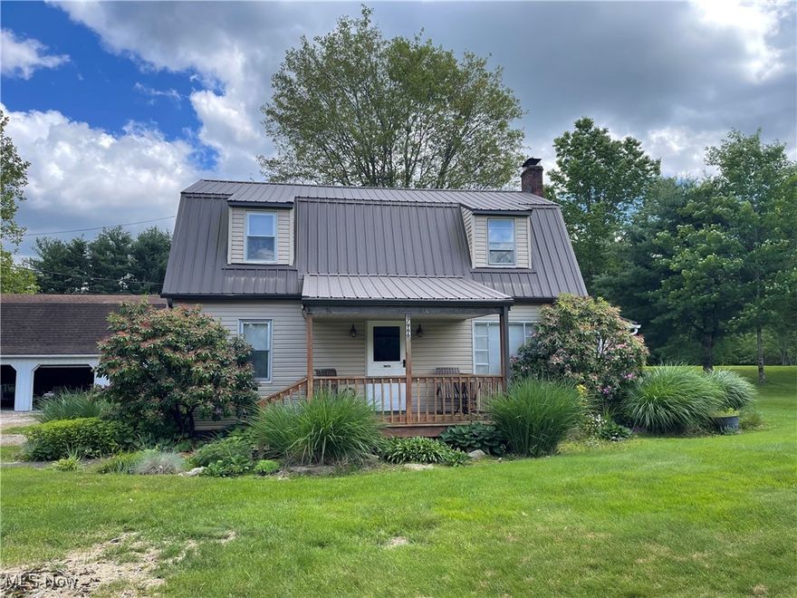 Welcome to this unique and inviting home featuring classic dormers and a striking silhouette that blends rustic charm with modern comfort. Nestled on 2.8 peaceful acres just on the outskirts of town, this property offers room to breathe while keeping you close to everyday conveniences.

Step inside to find large bedrooms, modern kitchen, a spacious living room perfect for entertaining, and a huge addition that adds versatility to the layout—ideal for a home office, family room, or future in-law suite. The sun porch at the rear of the home is a relaxing retreat, offering panoramic views of the serene backyard.

Outside, a 24x32 detached garage with loft provides ample space for vehicles, storage, or hobbies. With nearly 3 acres of open land, there's plenty of room for gardening, play, or even a small hobby farm.

Whether you're looking for more space, a touch of country charm, or just a place to call your own, this property has it all. Schedule your showing today and imagine the possibilities!