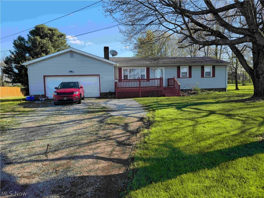 Charming Ranch Home on Nearly an Acre with Stunning Views! Welcome to this well-appointed ranch home where the property truly steals the show! Nestled on almost an acre of land, enjoy exceptional privacy and beautiful views right from your backyard. The main level offers comfortable single-floor living with three bedrooms, two full baths, and main-level laundry. The updated kitchen features laminate countertops, laminate wood flooring, a double oven, and all appliances included. The spacious living room boasts a large picture window that fills the space with natural light. Step outside onto one of two wooden decks — front or back — perfect for relaxing and taking in the scenery. Downstairs, the partially finished basement offers exciting potential, with two drywalled rooms ready for completion, a cozy wood-burning stove, Ohio State waterproofing with  transferable warranty, and two sump pumps. The well and septic were installed in 2022. Outside, enjoy summer fun with the above-ground pool and surrounding deck, plus a two-car attached garage and a shed that stays with the property. Plus, the wired camera system will stay ensuring peace of mind. Schedule your showing today!