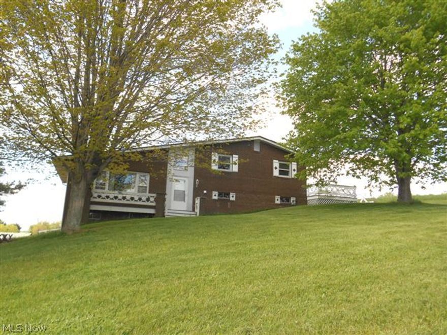 Nice 3 or 4 bedroom, 2 full bathroom split level home on 28 beautiful acres with free gas. This home has a brand new septic system. Main level has large living room with cathedral ceilings, kitchen with breakfast bar, formal eating area, and a 4 seasons sun room overlooking the property. Upstairs has 3 bedrooms and a full bathroom. The lower level features a family room with wood burning fireplace, 4th bedroom or office, and another full bathroom/laundry room. There is a 2 car attached garage. 28 acres consists of 2 outbuildings/barns and gently rolling landscape perfect for pastures and or tillable land. Many possibilities with this fantastic property.